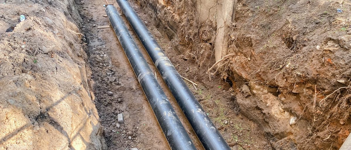 Underground service pipes laid in a trench on a residential street